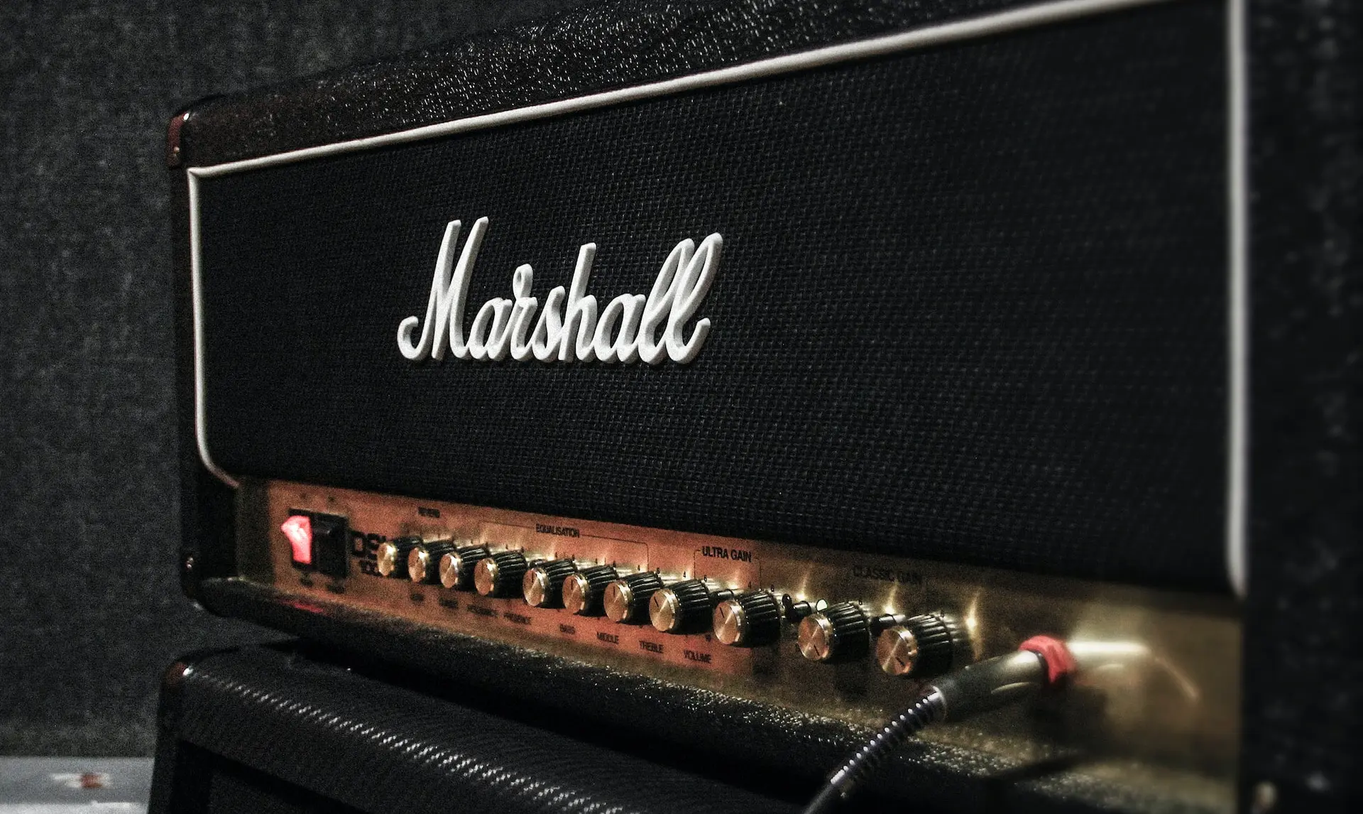 cable plugged in Marshal guitar amplifier